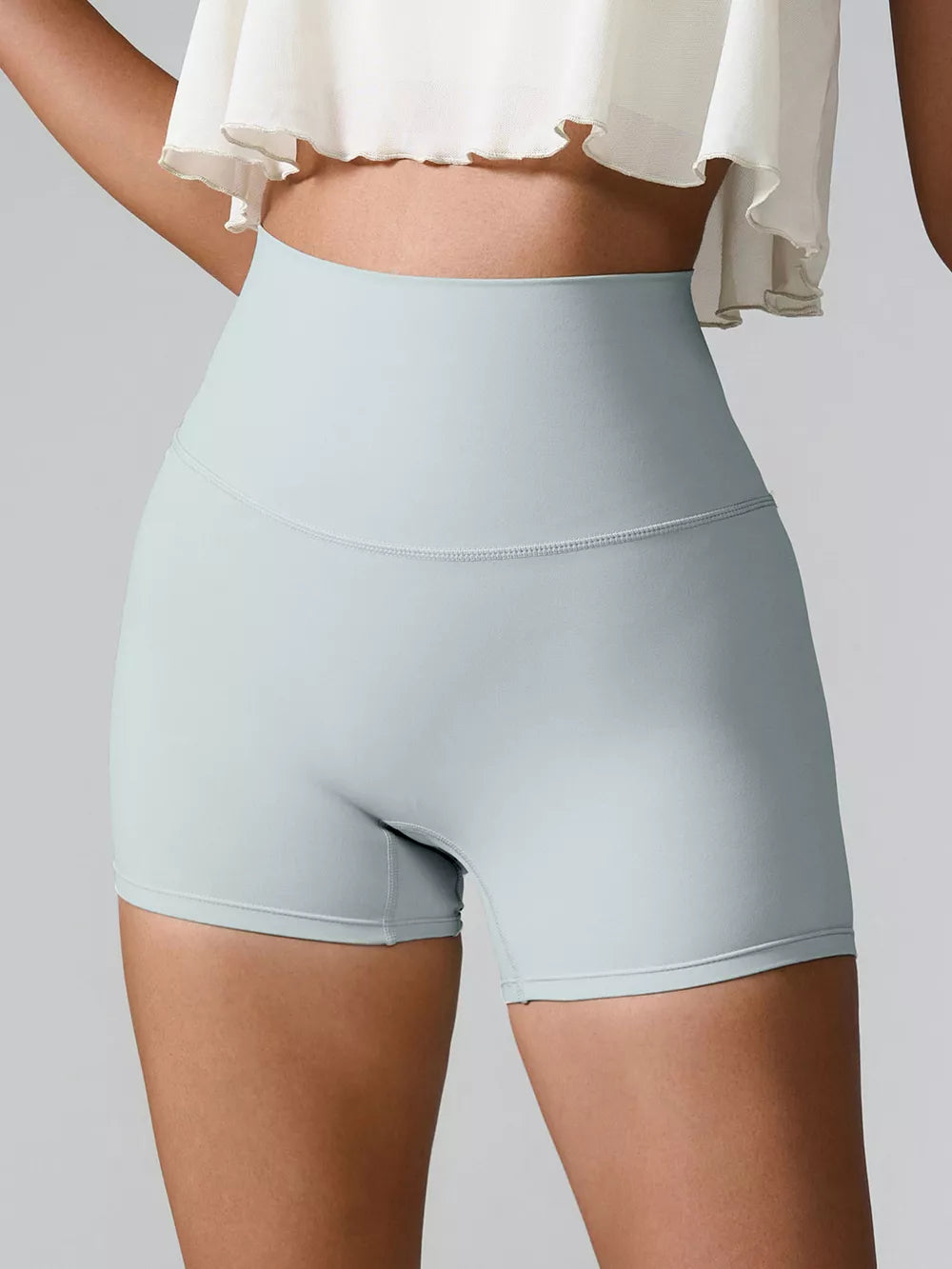 Back view of black high-waist active shorts.