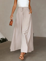 Front view of pale beige wide-leg pants with a gathered waist