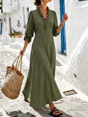 Olive V-neck maxi dress with roll-up sleeves styled with woven tote