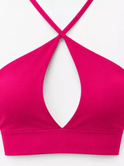 Close-up of hot pink halter crop cami neckline and front cutout