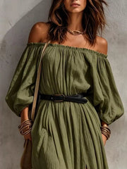Close view of moss-green off-shoulder maxi dress with gathered neckline and belt