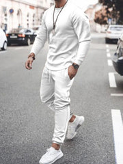 Model wearing white long-sleeve top and jogger pants set