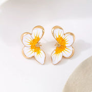 Pair of yellow-and-white flower stud earrings, front view