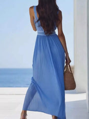Back view of sky-blue pleated maxi dress worn by model