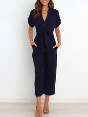 Women's notched short-sleeve tie-waist jumpsuit, navy full front view