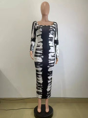 Front mannequin view of black and white tie-dye long-sleeve dress