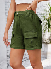 Side view of olive cargo shorts with large flap pocket.