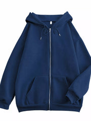 Front view of the navy oversized zip-up hoodie with drawstring hood and pockets