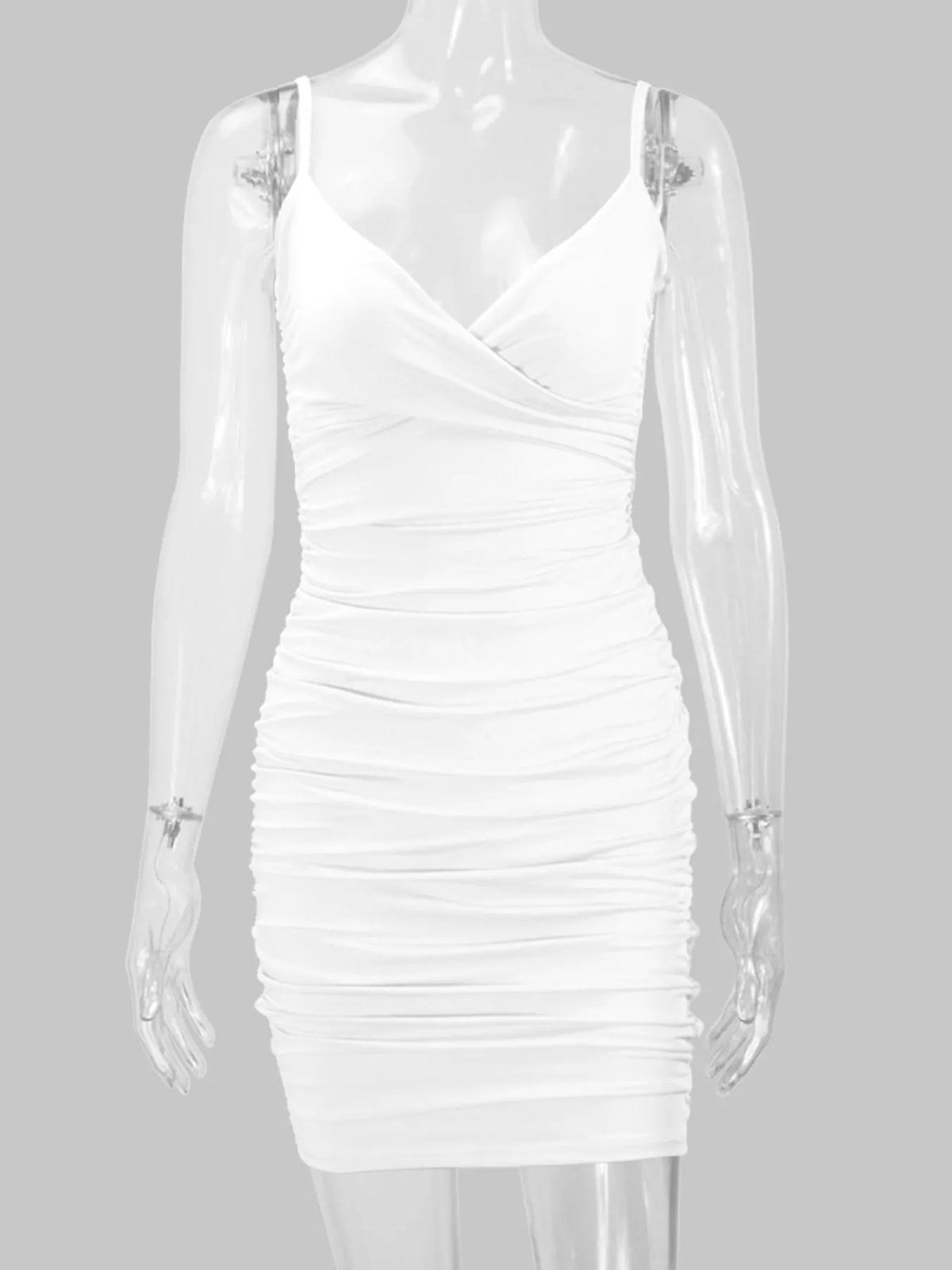 White spaghetti-strap ruched mini dress displayed front-facing on a mannequin.
