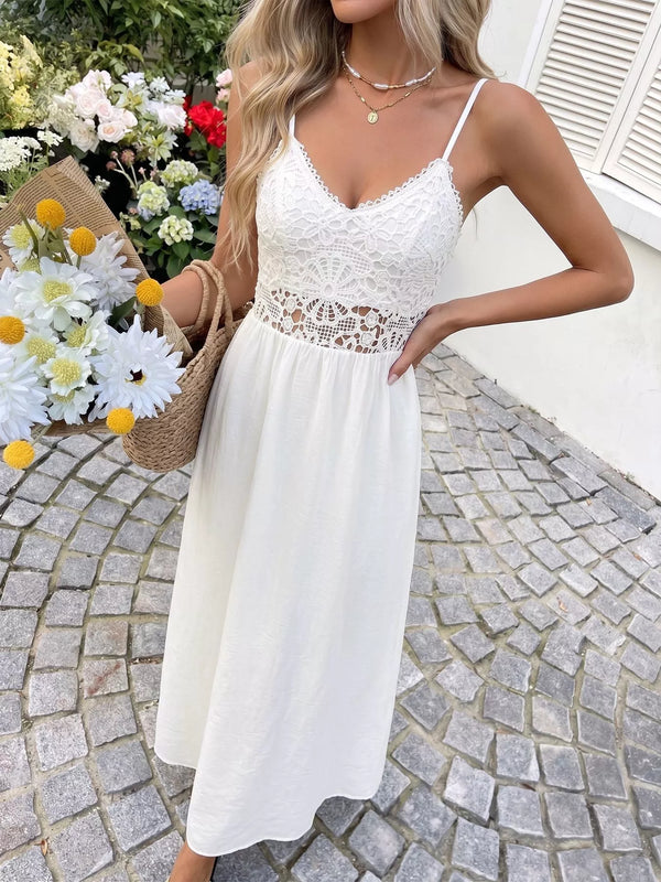White flowy maxi dress with lace bodice and gathered skirt