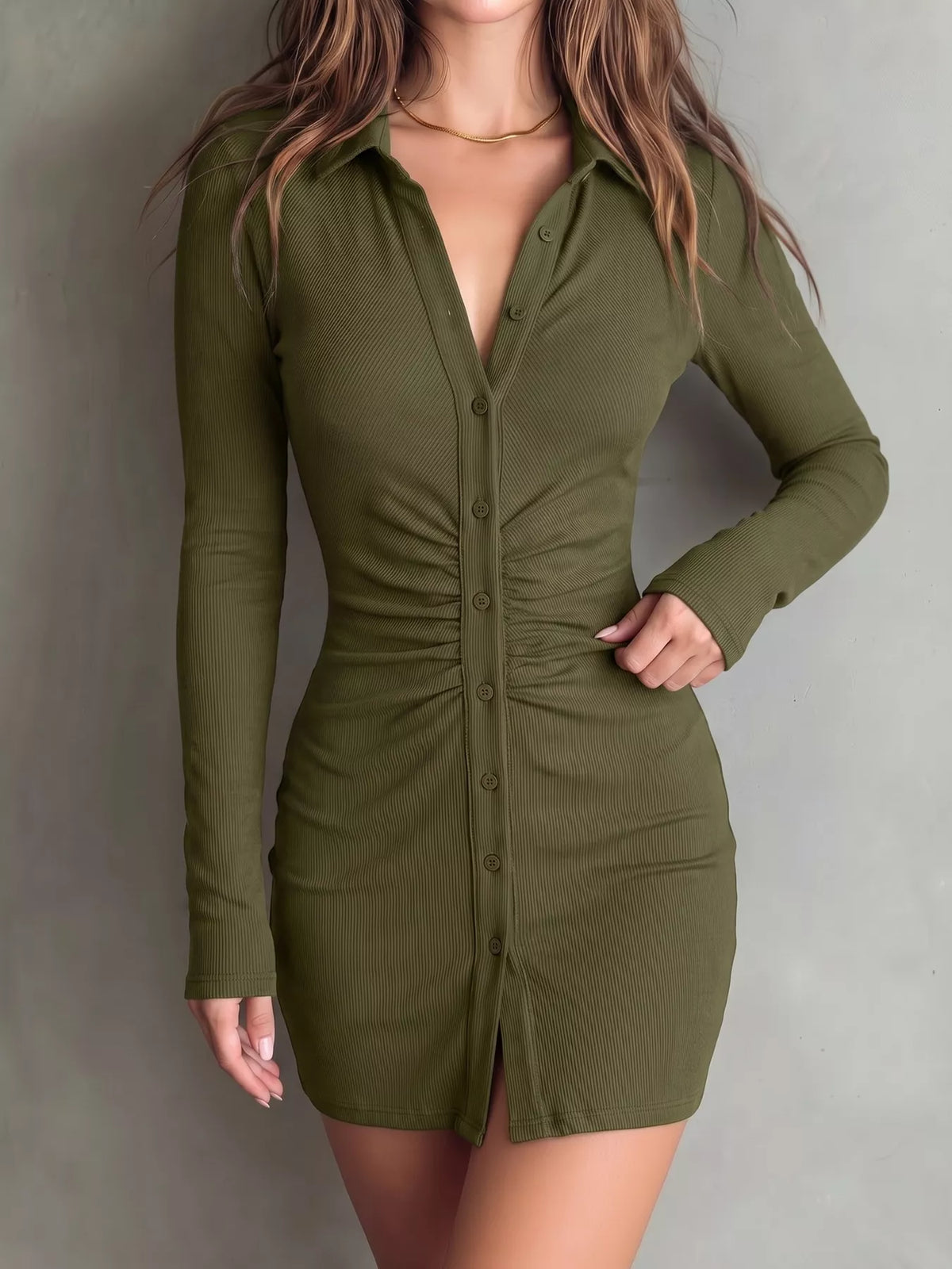 Back view of olive mini dress with long sleeves and fitted waist.