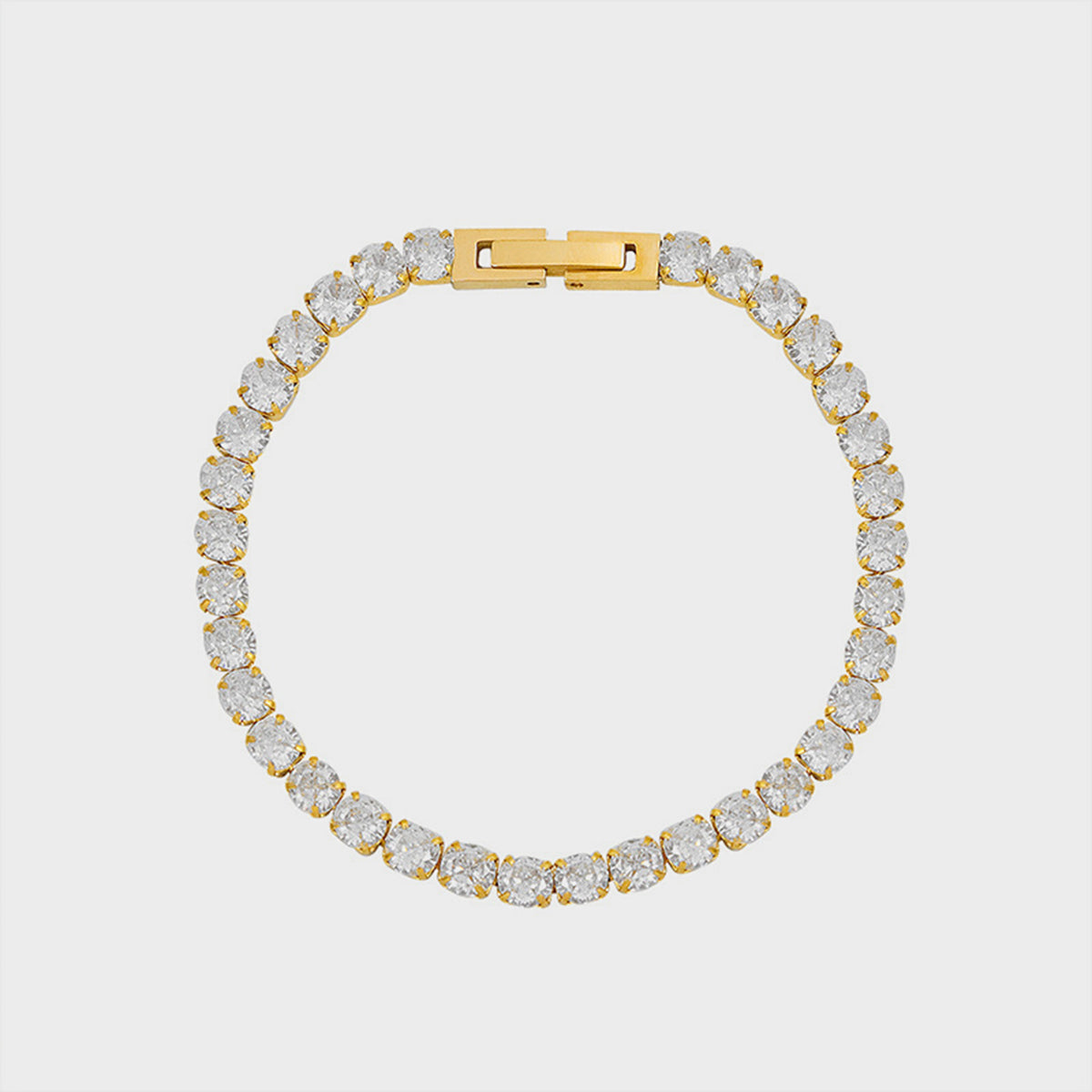 Gold-tone tennis bracelet set with a continuous row of round clear stones