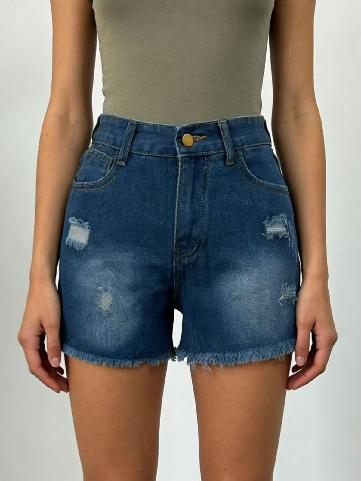 Front view of dark-wash denim shorts with distressed details