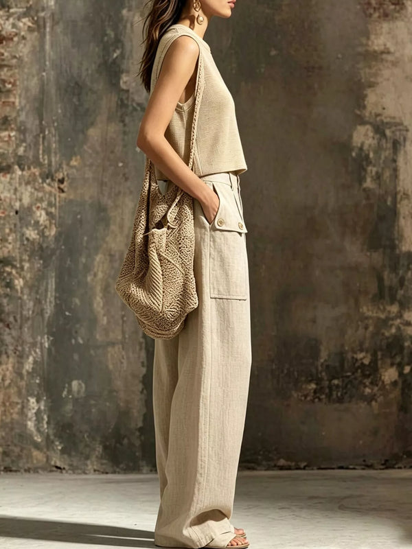 Side view of beige sleeveless crop top and cargo pants with side pockets