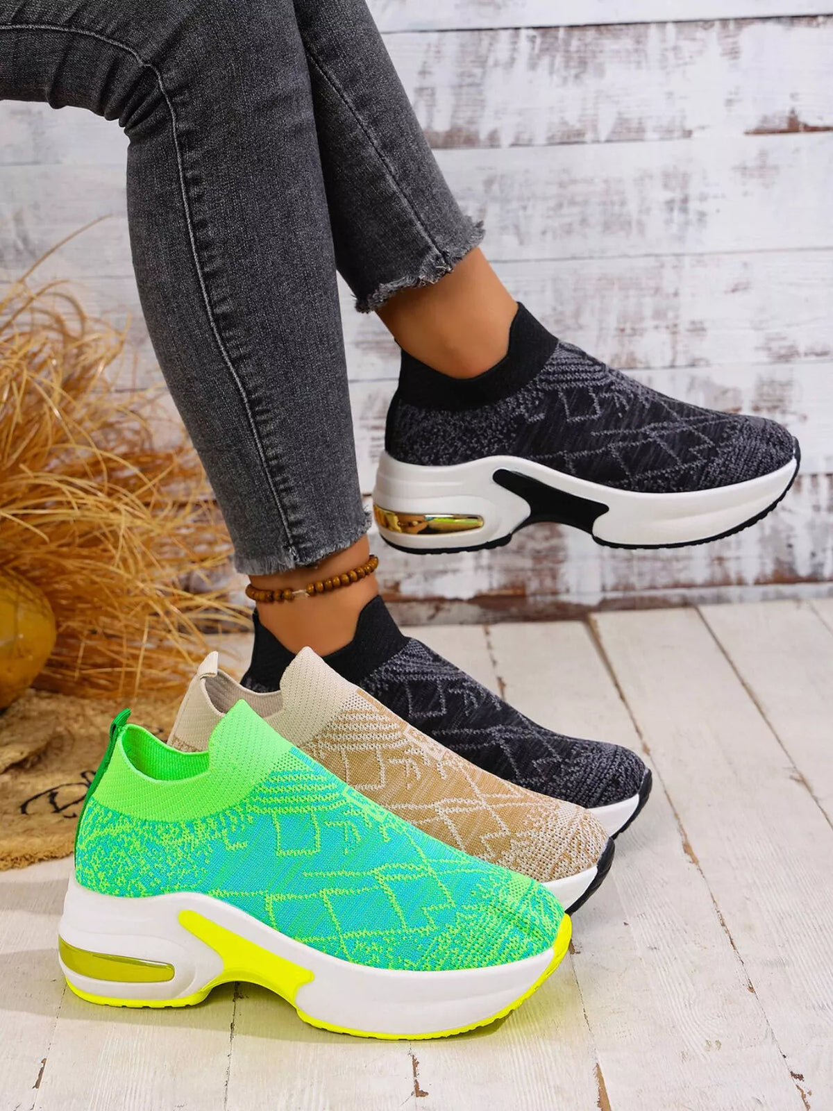 Black patterned mesh platform trainers worn beside lime green and beige colour options