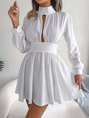 Model wearing the white cutout turtleneck A-line mini dress