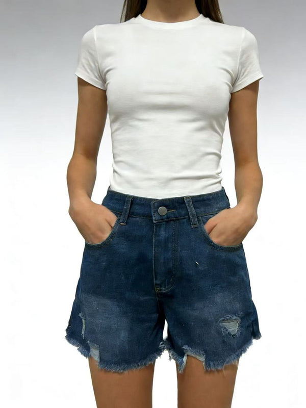 Front view of dark blue distressed denim shorts with frayed hems and front pockets, worn with a white T-shirt