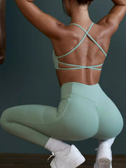Three-quarter front view of seamless cross-waist cami and leggings active set