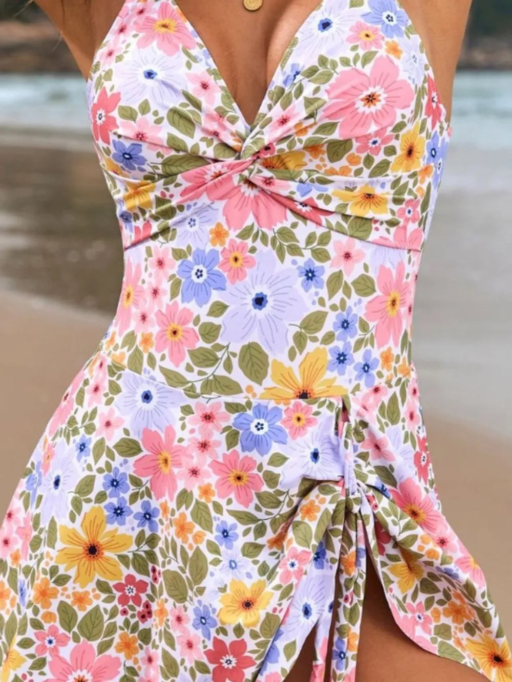 Close detail of multicolour floral swimsuit fabric and gathered front