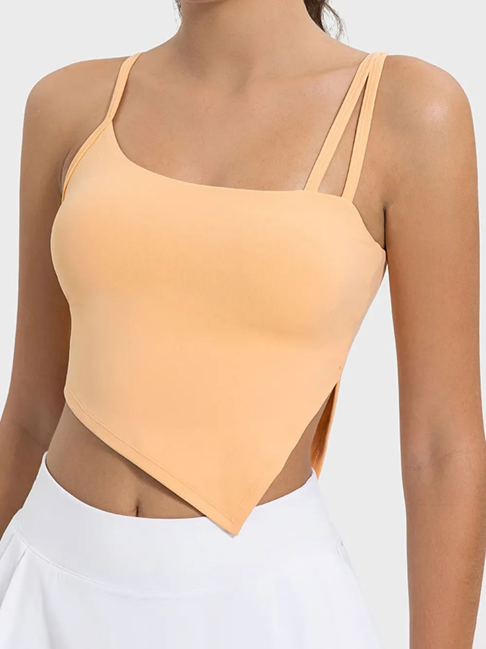Peach asymmetrical-hem active cami with double shoulder straps, front view