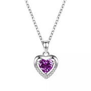Silver-tone heart necklace with purple center stone on white background
