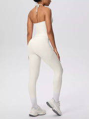 Side view of halter neck cami and high-waisted leggings active set