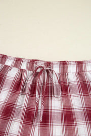 Red plaid pajama shirt and drawstring shorts shown from behind