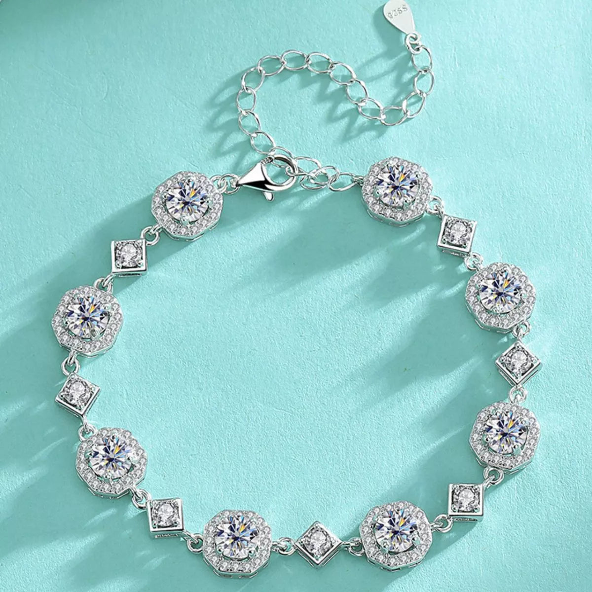 Overhead view of the silver-tone bracelet with alternating round and square stones
