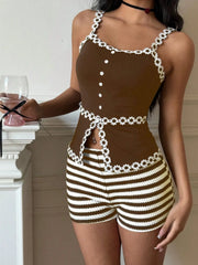 Model wearing brown striped shorts and matching trimmed top