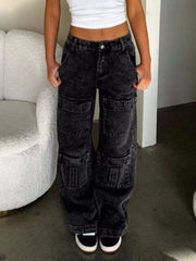Front view of acid-wash black wide-leg cargo jeans with large thigh pockets