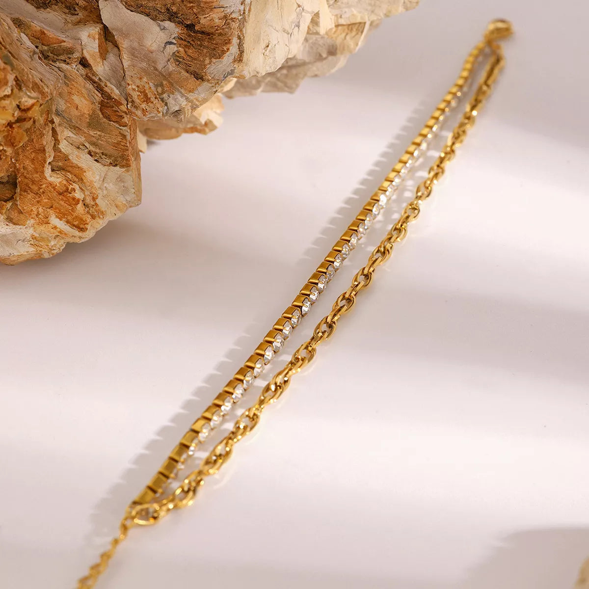 Detail of two bracelet layers and adjustable chain