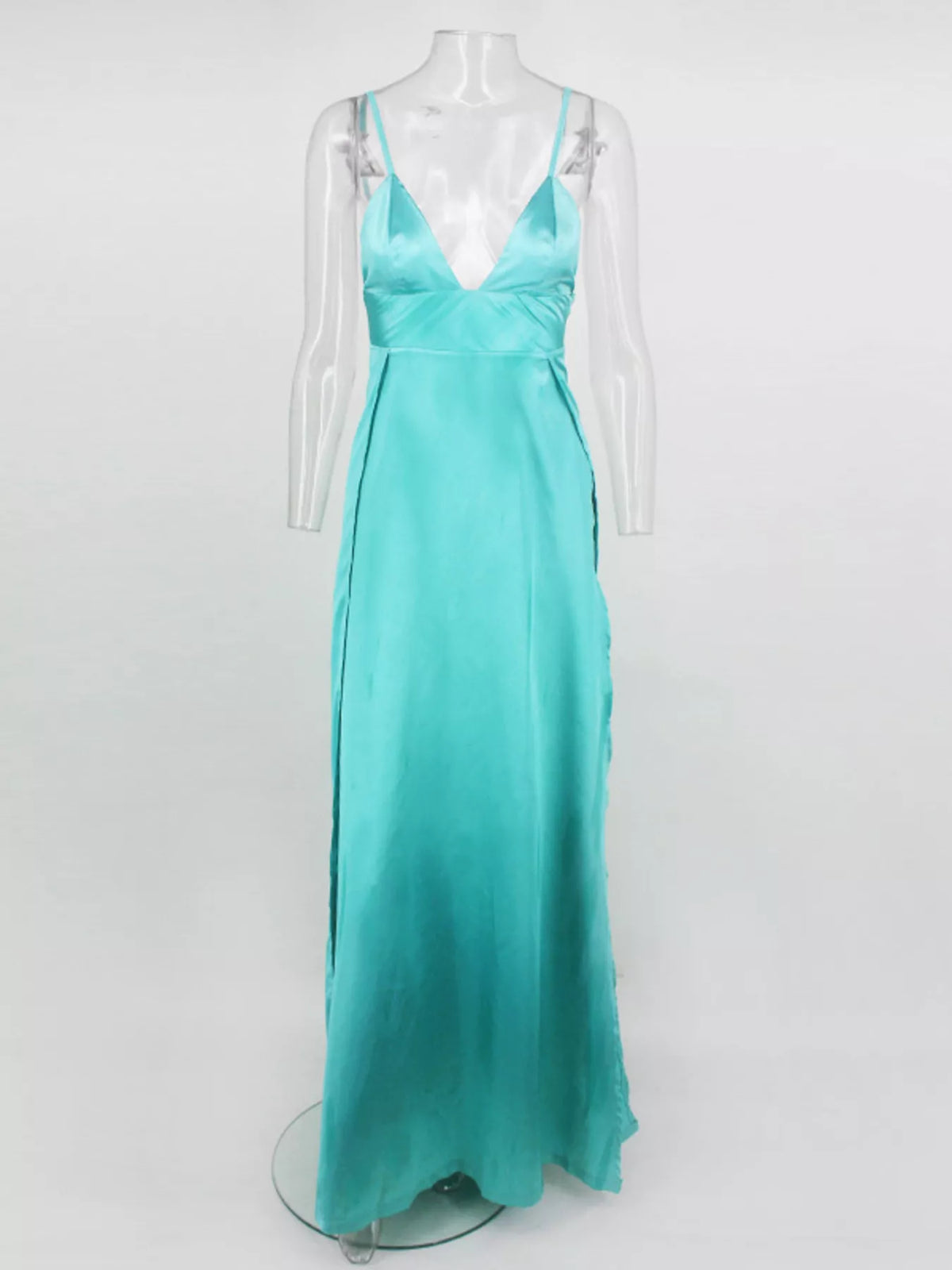 Full-length front view of turquoise strappy maxi dress on a display form