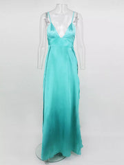 Full-length front view of turquoise strappy maxi dress on a display form