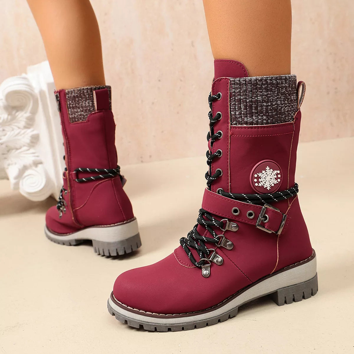 Burgundy lace-up boots shown from the front