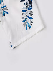 Close-up of the shorts leg hem and tropical leaf print