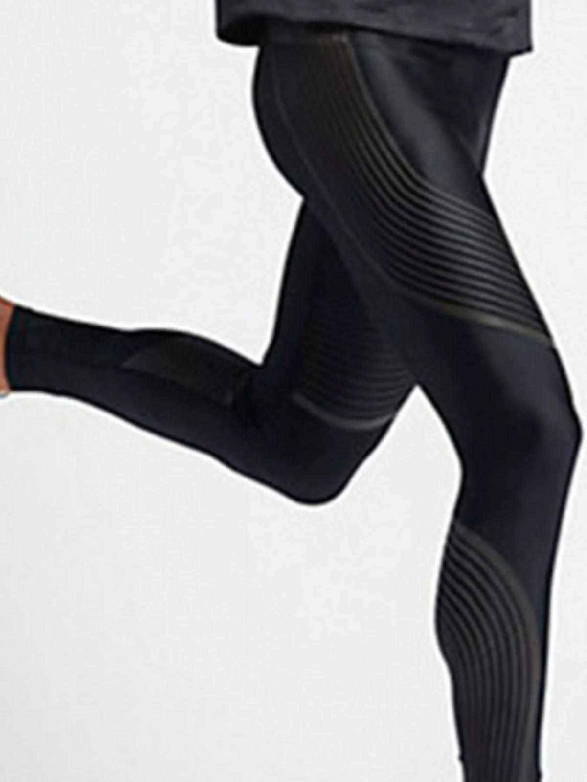 Side view of black active leggings in a running pose showing curved leg details