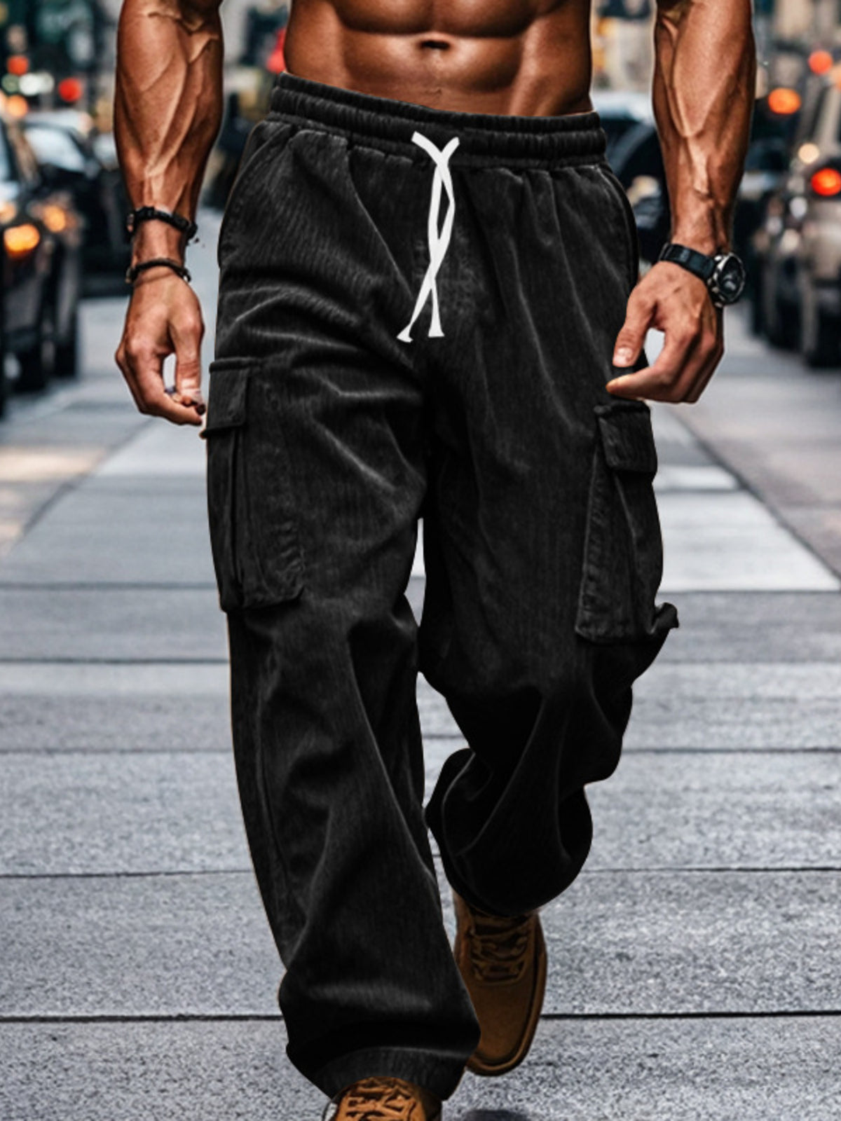Model wearing corduroy cargo pants with a drawstring waist