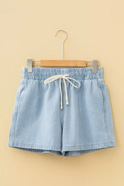 Front product view of light blue striped shorts on a wooden hanger.