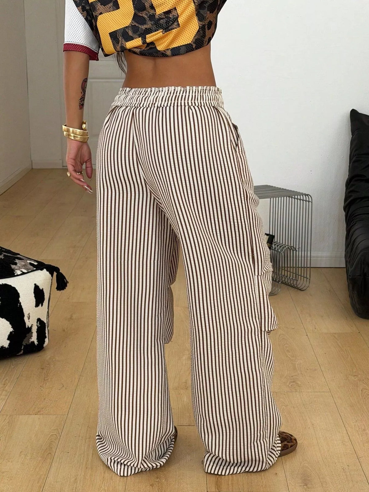 Back view of brown-and-cream striped wide-leg pants
