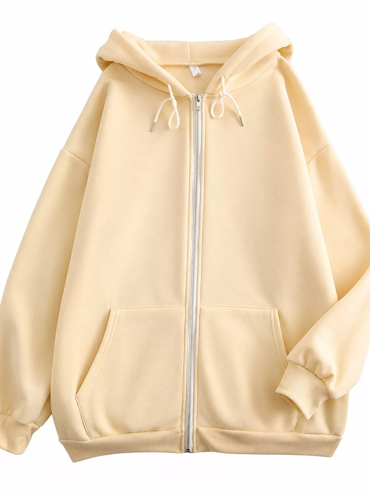 Front view of the cream oversized zip-up hoodie with hood and split kangaroo pockets