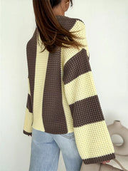 Back view of cream and brown colour-block sweater with wide horizontal sleeve bands