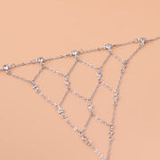 Close-up of rhinestone accents along the gold-tone hand chain