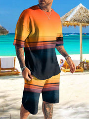 Man wearing orange-to-black gradient graphic shirt and matching shorts on a beach