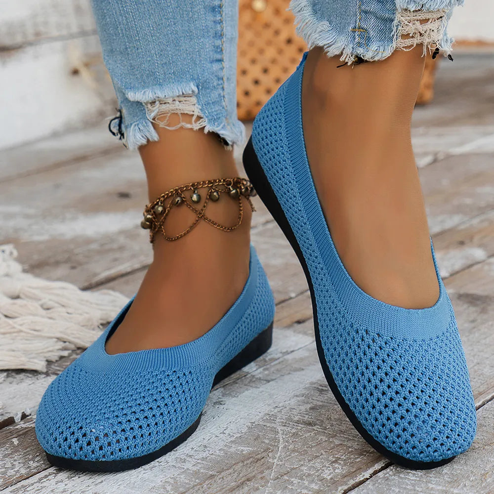 Blue mesh flats worn with cropped jeans, front angled view