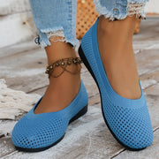 Blue mesh flats worn with cropped jeans, front angled view