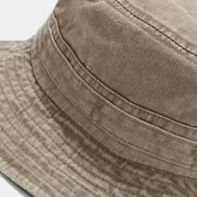 Close-up of the crown seams and wide stitched brim on the khaki bucket hat