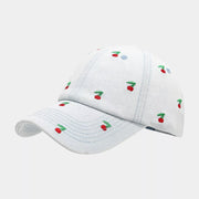 White denim baseball cap with small red cherry embroidery