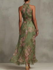 Back view of the sleeveless green floral-print maxi dress.
