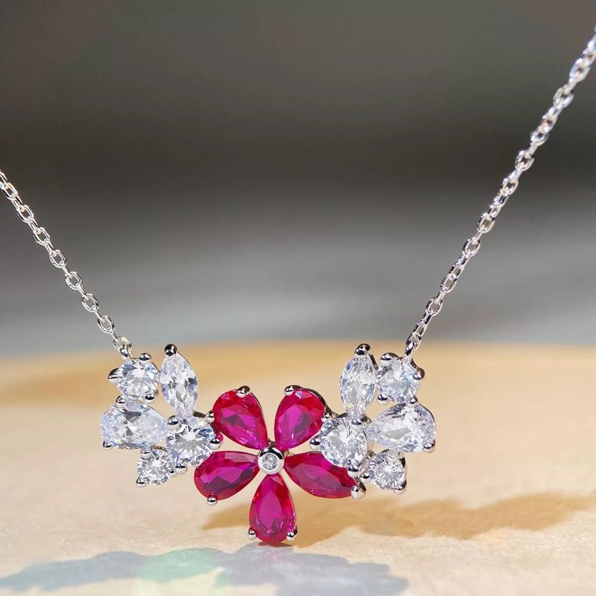 Silver-tone flower necklace with cerise pink center stones