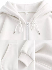 Close-up of the white hoodie hood drawstrings, zipper, pocket seam and ribbed cuff